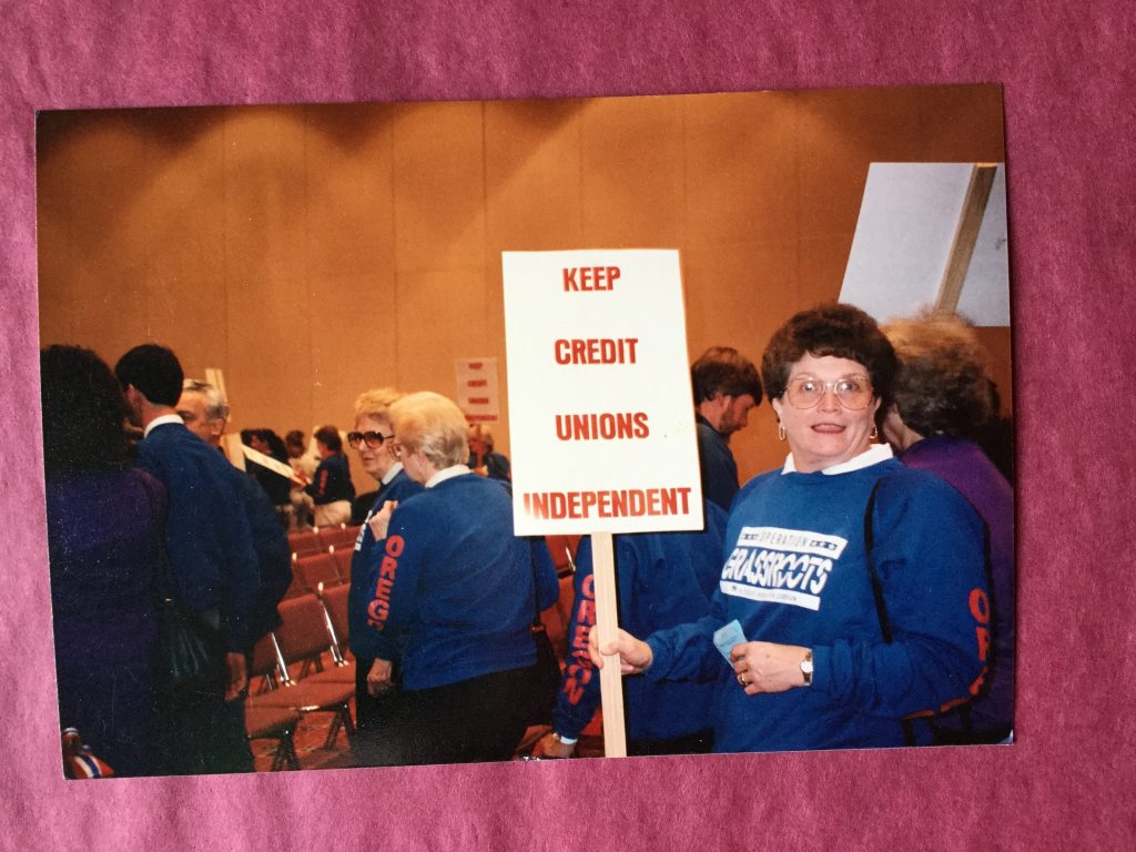Employee with a sign in the 90s