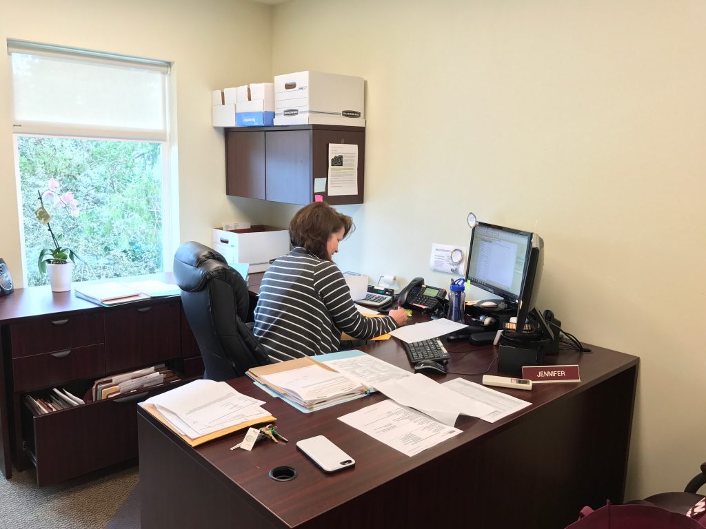 Jen at her desk